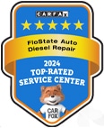 A badge shows the CARFAX logo with five gold stars, the text "2024 Top-Rated Service Center," and a cartoon fox wearing a shirt with "CAR FAX" on it against a blue background.