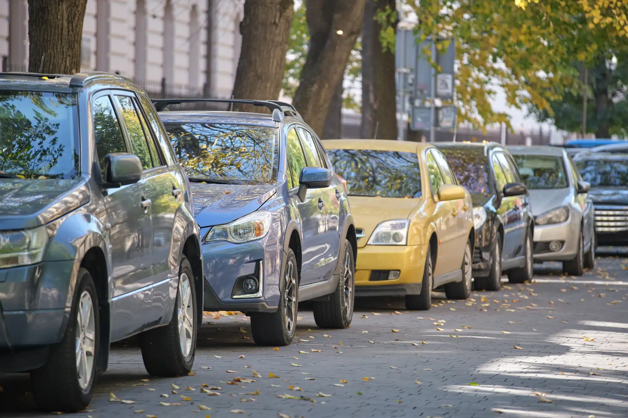 Cars parked along a residential street, highlighting reliable auto repair and vehicle maintenance services
