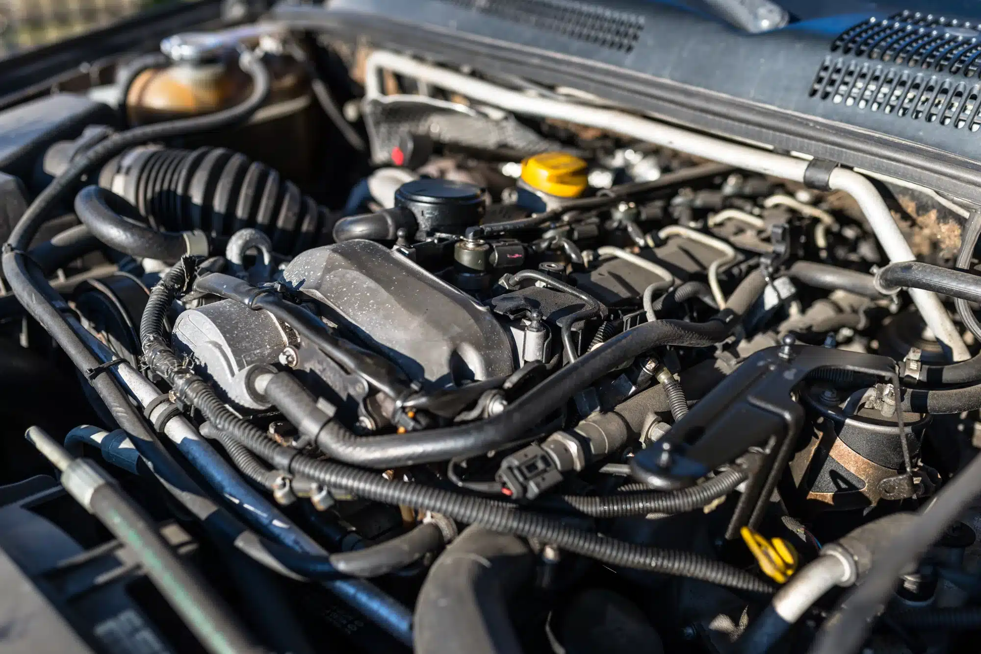 Close-up of a vehicle engine during professional auto diagnostics and maintenance service